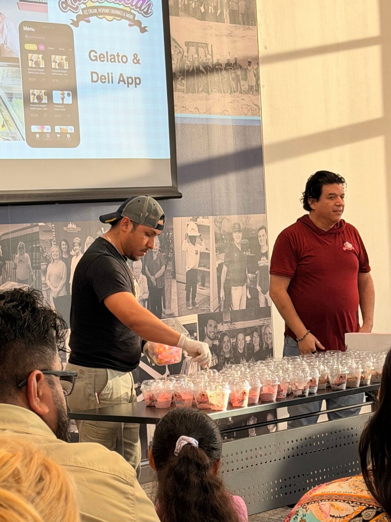 Las Delicias team presenting dessert cups during a group visit