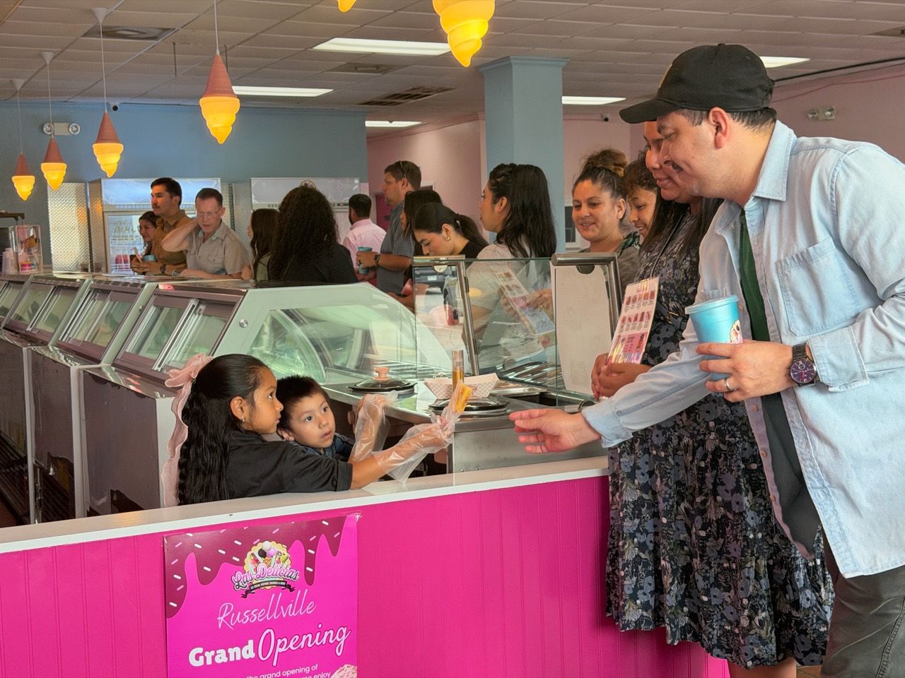 Families gathered at the Las Delicias Russellville grand opening counter